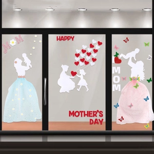 Detail of Mother's Day window decals with baby silhouette, hearts, and floral butterflies