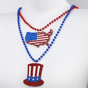 Close-up of July 4th necklaces with glittery USA map and Uncle Sam hat pendants