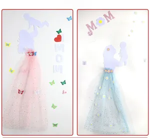 Detail of Mother's Day wall decor featuring a mom silhouette with a sequined tulle dress