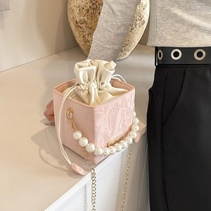 Pink marble pattern square box bag with large pearl handle and gold chain strap