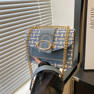 Blue and white tweed shoulder bag with gold chain strap and elegant metallic buckle