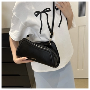 Close-up of black PU leather shoulder bag featuring gold Fashion & Bags lettering detail