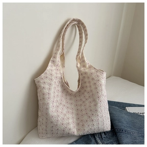 Chic tote bag with pink flower embroidery and minimalist design for casual daily use
