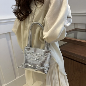 Silver metallic handbag with five bow accents and bead chain strap for women