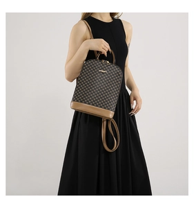 Detail of checkered brown backpack worn by a model in a minimalist style