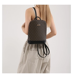 Detail showing vintage checkered pattern with black leather trim and golden metal logo