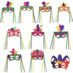 Carnival party glasses with colorful feathers and tinsel for Mardi Gras masquerade masks