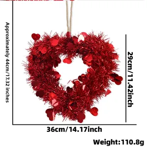 Detail of red tinsel heart wreath with sequins showing 44cm height and 36cm width dimensions
