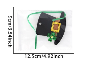 Detail of St. Patrick's Day mini black top hat hair accessory with green shamrock decor