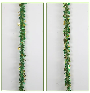 Detail of 2m St. Patrick's Day garland with green shamrocks and gold circular tinsel decor