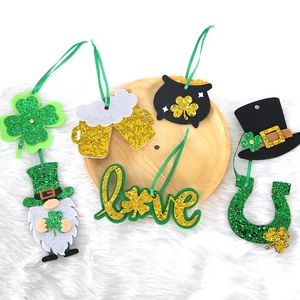 Glitter felt St. Patrick's Day ornaments with clover and leprechaun hat party decor