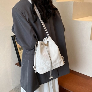 White minimalist bucket bag with butterfly decor and pearl drawstring for women
