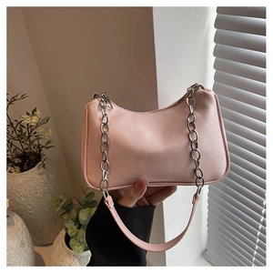Pink crescent underarm bag with silver thick chain and textured PU leather finish