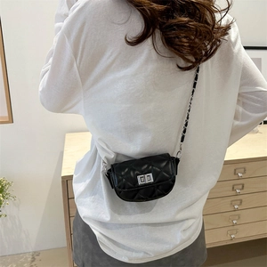 Classic black quilted saddle bag with silver chain strap and metal swivel lock