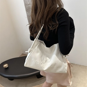 Minimalist off-white leather underarm tote bag with embossed letters and pleated design