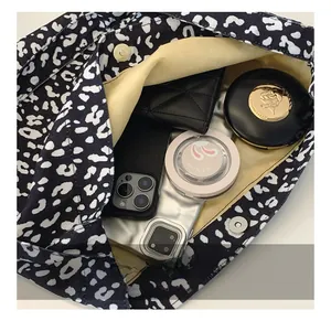 Internal view of leopard print canvas tote bag showing magnetic buckle and large capacity