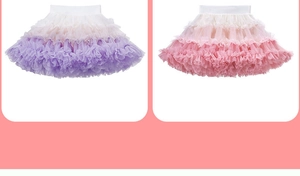 Detail of layered tulle tutu skirts with rainbow gradient colors and elastic waistbands