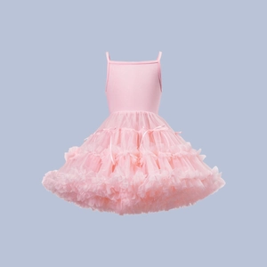 Detailed view of layered light pink tulle tutu dress with a delicate waist ribbon bow