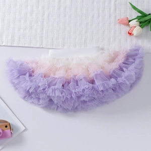 Detailed view of layered rainbow tutu skirt with white to purple gradient mesh fabric