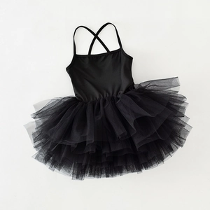 Detail of girls' black ballet tutu dress featuring a criss-cross back and layered tulle skirt
