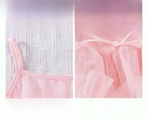 Detail of pink tutu dress showing elastic shoulder straps and layered mesh tulle fabric