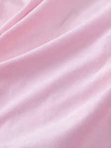 Detailed close-up of soft pink breathable cotton fabric texture for girl tutu skirt