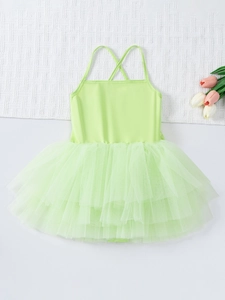 Detail view of the criss-cross back straps on a lime green ballet tutu dress for girls