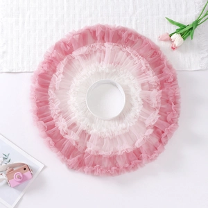 Detail view of pink and white gradient tiered tutu skirt with ruffled tulle layers