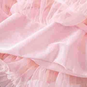 Close-up of pink layered tulle fabric and soft texture on a fluffy tutu skirt