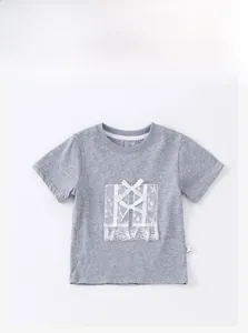 Close-up of girls' grey cotton tee featuring white lace patches and bow tie details