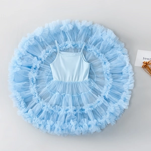 Detailed top view of light blue tutu dress featuring layered mesh and small bows