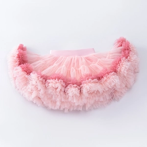 Detail of pink tiered tulle tutu skirt with elastic satin waistband and ruffled edges