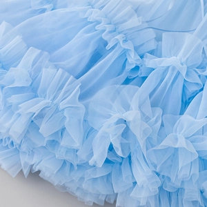 Close-up of layered light blue pleated mesh fabric showing puffy tutu skirt details