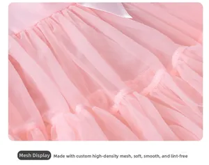 Detailed macro view of soft pink multi-layer mesh fabric with a white satin bow knot