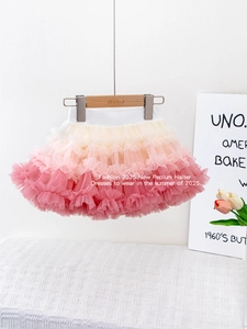 Girl's rainbow gradient tutu skirt with tiered mesh layers and elastic waistband
