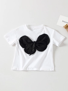 T-shirt bianca da bambina in cotone con grande fiocco in tessuto nero per l'estate