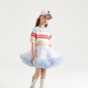 Detail of multi-layered light blue gradient tulle tutu skirt and heart pattern knit top
