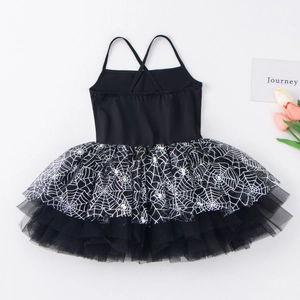 Detailed close-up of girls black tutu dress with white spider web printed mesh layers
