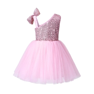 Detail of sequined bow on a pink sequin tulle one-shoulder flower girl party dress