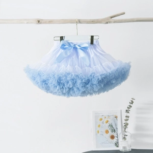 Detail of light blue and white tiered tutu skirt with a large satin bow decoration