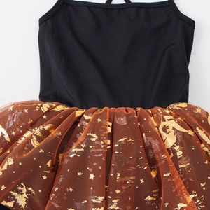 Detail view of stitching between black bodice and orange mesh skirt with gold star foil
