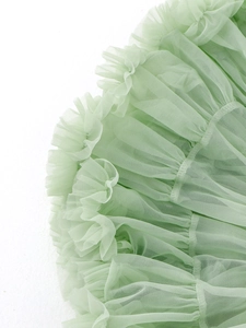 Mint green multi-layered tutu skirt showing ruffled tulle texture and fine mesh craftsmanship