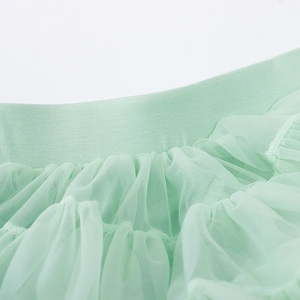 Detail of the high-elastic waistband and multi-layer mint green mesh tulle of the tutu skirt