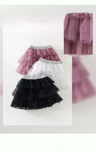 Detail view of girls layered tulle tutu skirt with silver sparkle dots and elastic waist