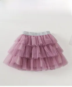Detail of pink tiered mesh tutu skirt with white polka dots and silver glitter waistband