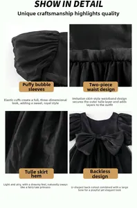 Detail eines schwarzen Tüllkleids für Mädchen mit Puffärmeln, Gürtel und Rückenschleife