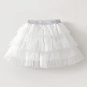 Detail of white layered tulle tutu skirt with silver glitter and elastic waistband