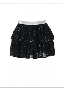 Detail of girls' black sequin tutu skirt with shimmering layers and silver elastic waistband