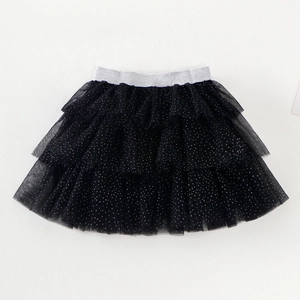 Detail of multi-layer black tulle tutu skirt with silver polka dots and elastic waistband