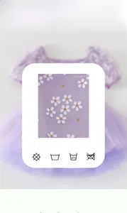 Close-up of purple ballet dress featuring delicate petal prints and soft mesh fabric texture
